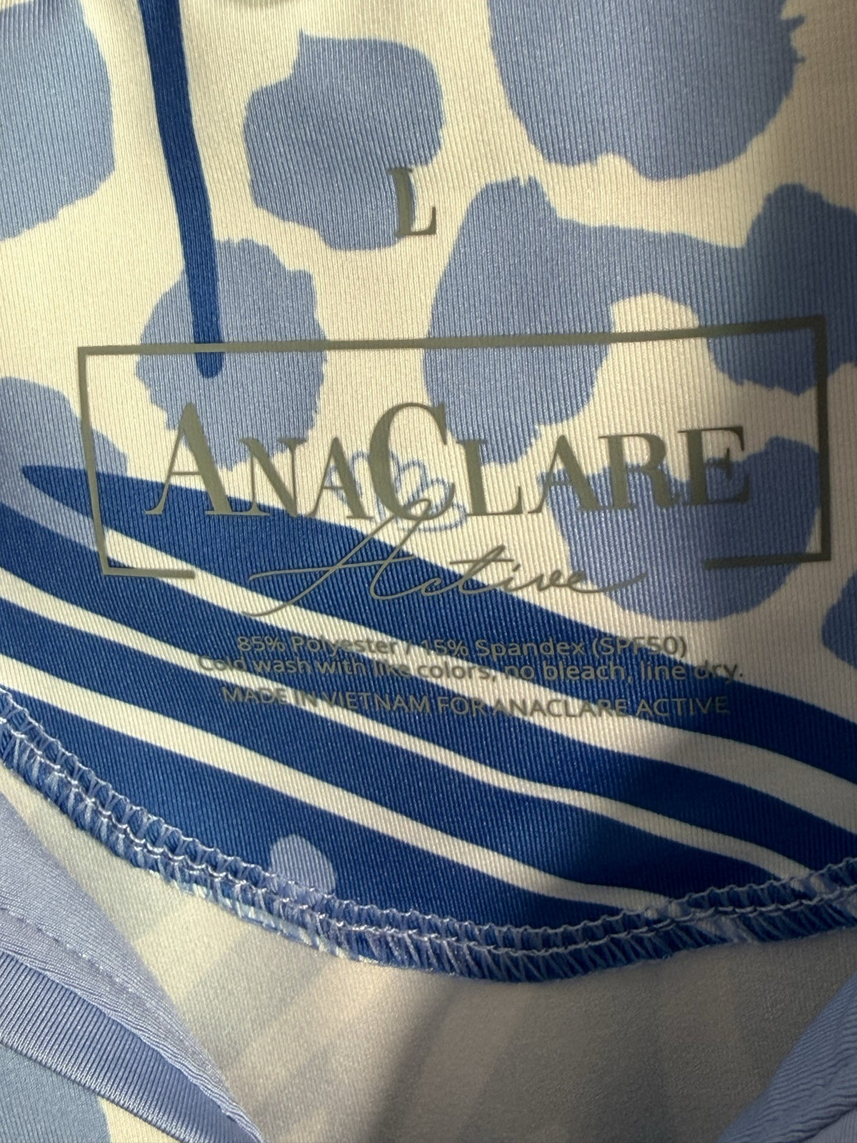 AnaClare Polo brand and size label