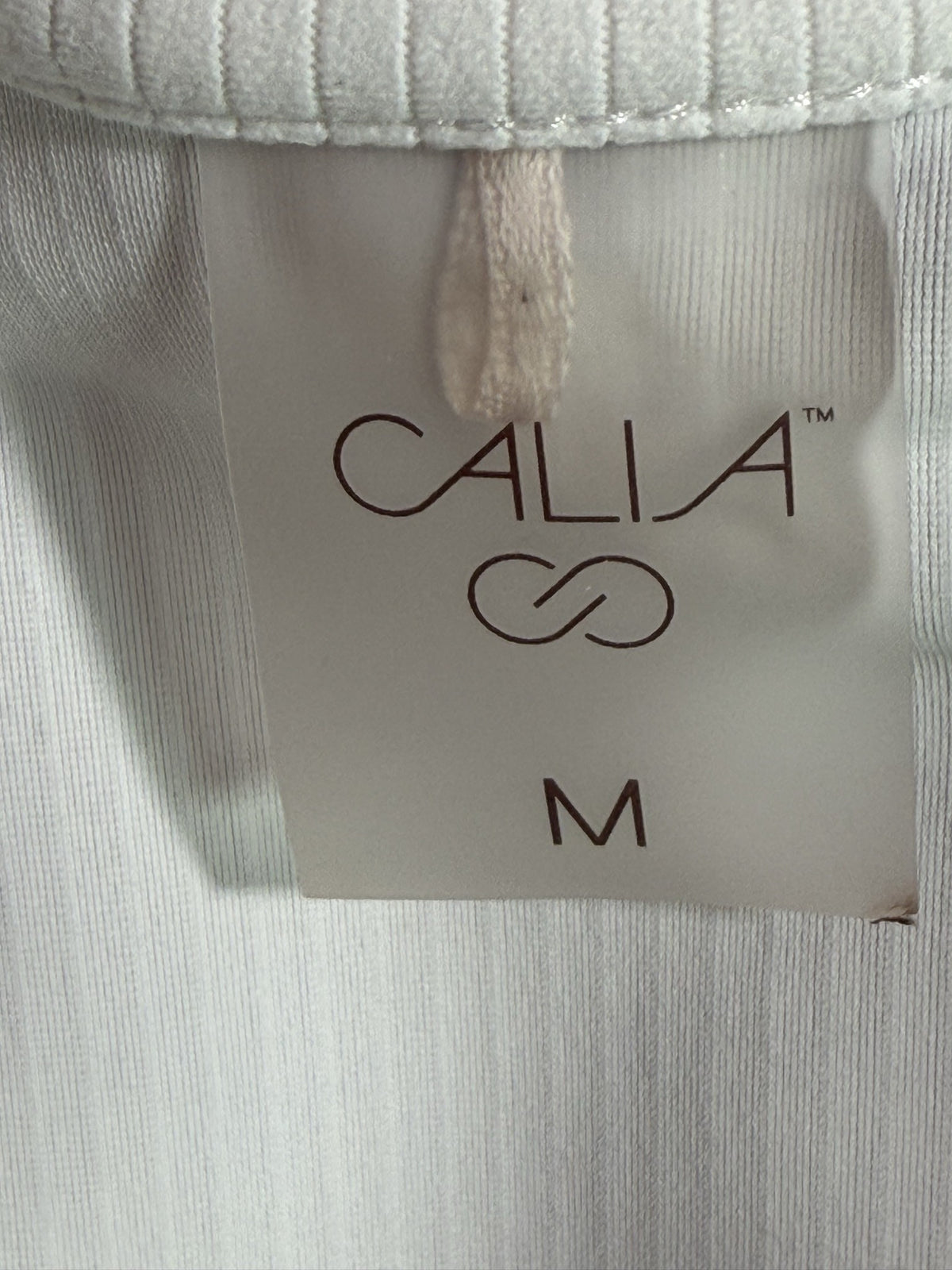 Calia Polo brand and size label
