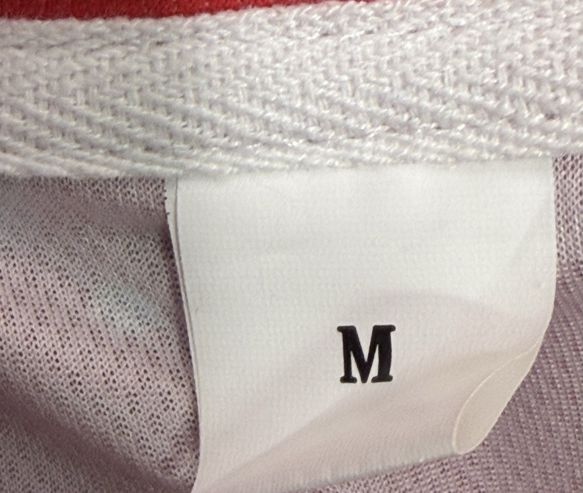 Women's Golf Sleeveless Polo brand and size label