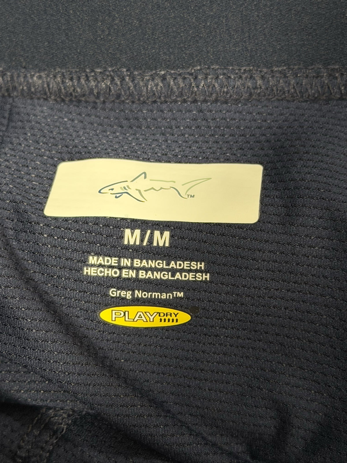 Greg Norman navy skort, brand and size label