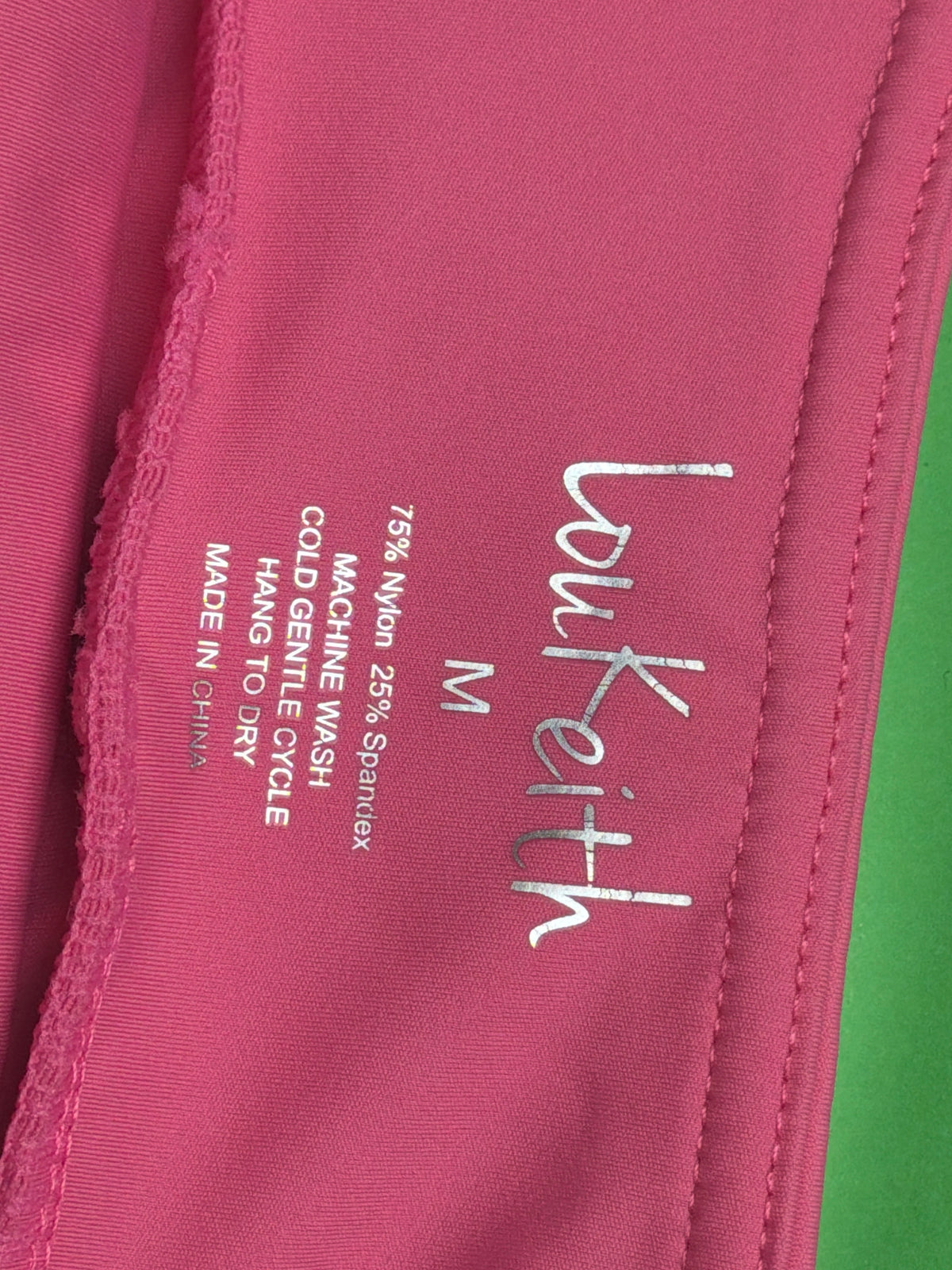 LouKeith pink golf skort, brand and care label