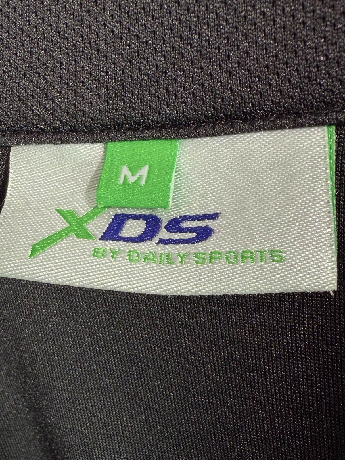 XDS by Daily Sports Long-Sleeve Quarter-Zip brand and size label
