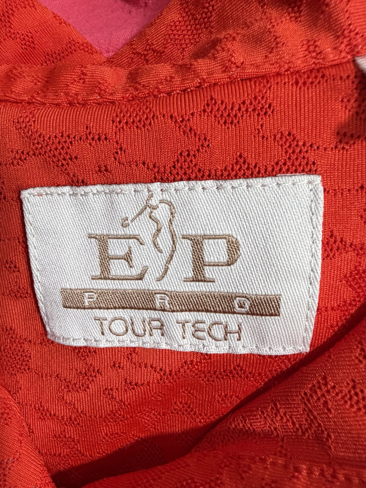EP Pro Sleeveless Polo brand and size label
