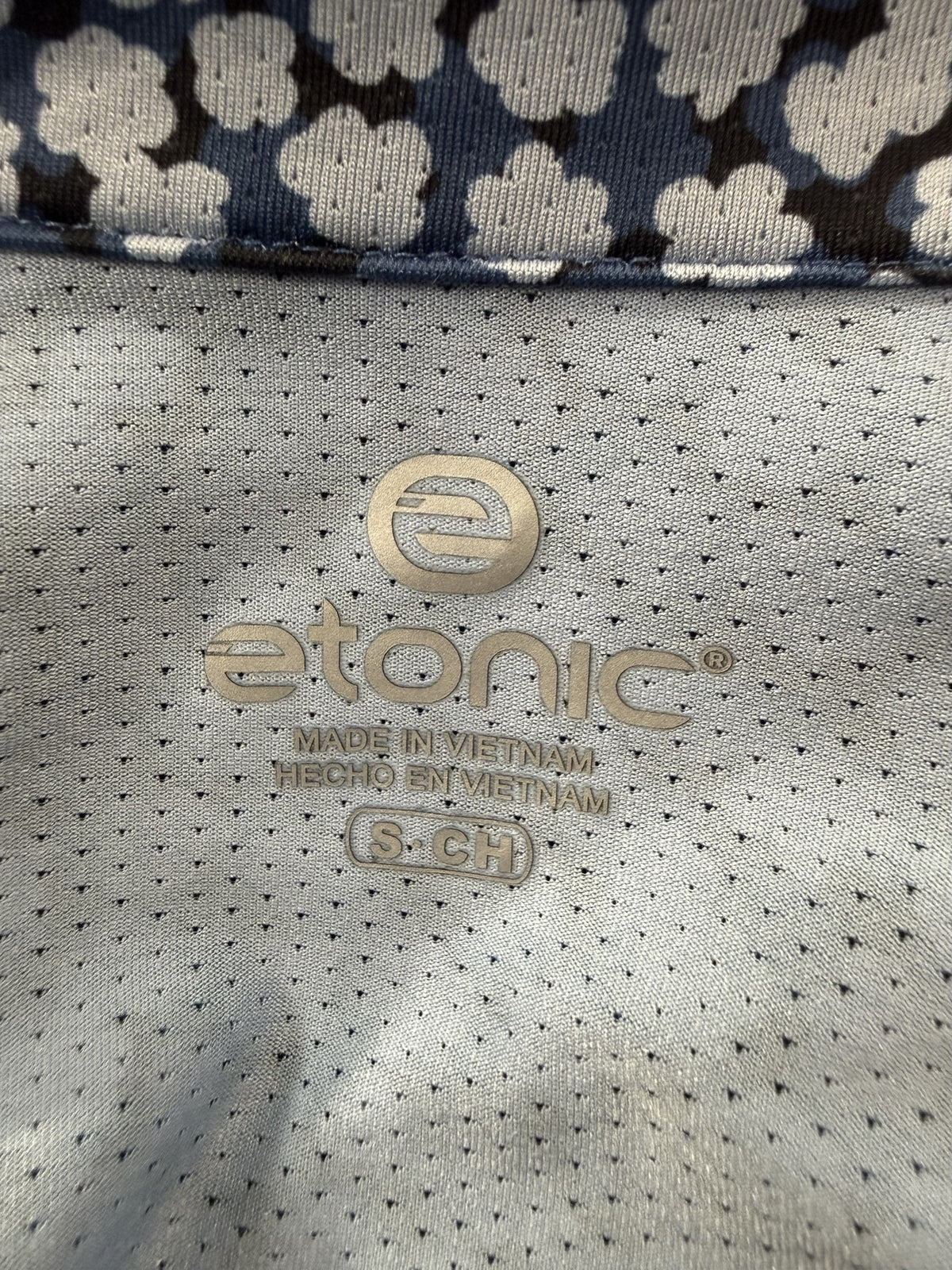 Etonic Sleeveless Quarter-Zip brand and size label