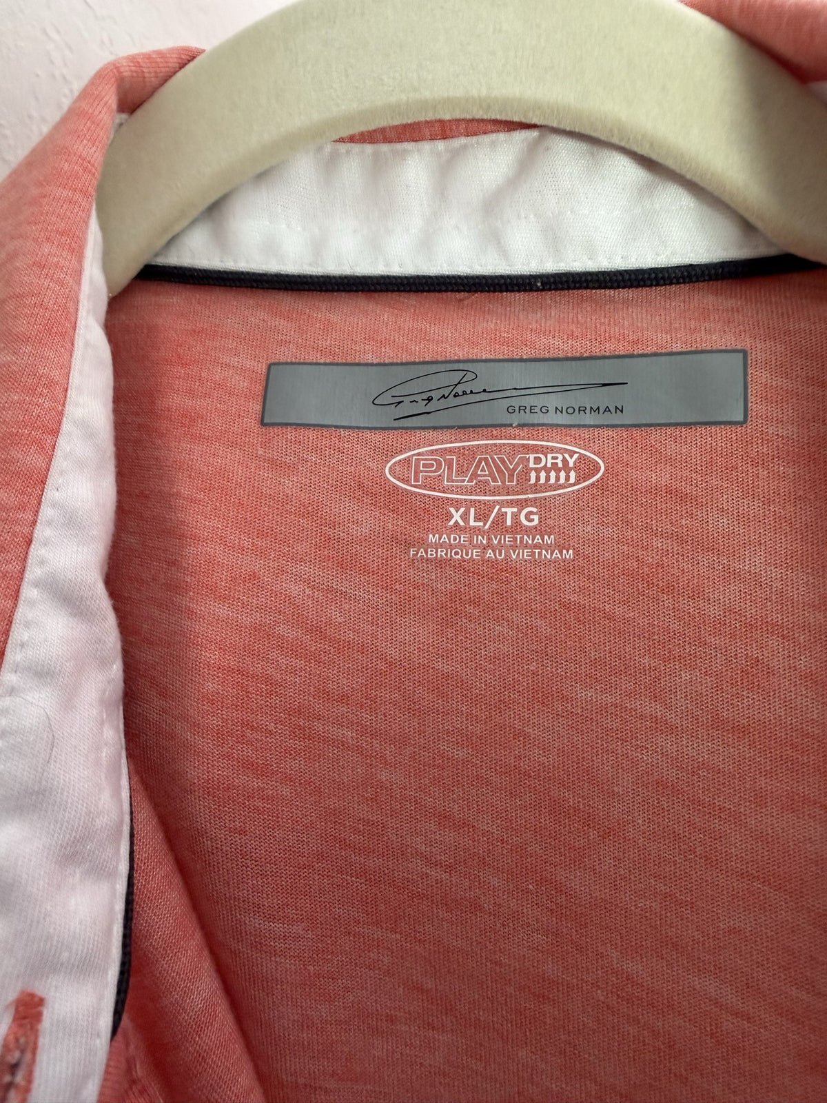 Greg Norman Polo brand and size label