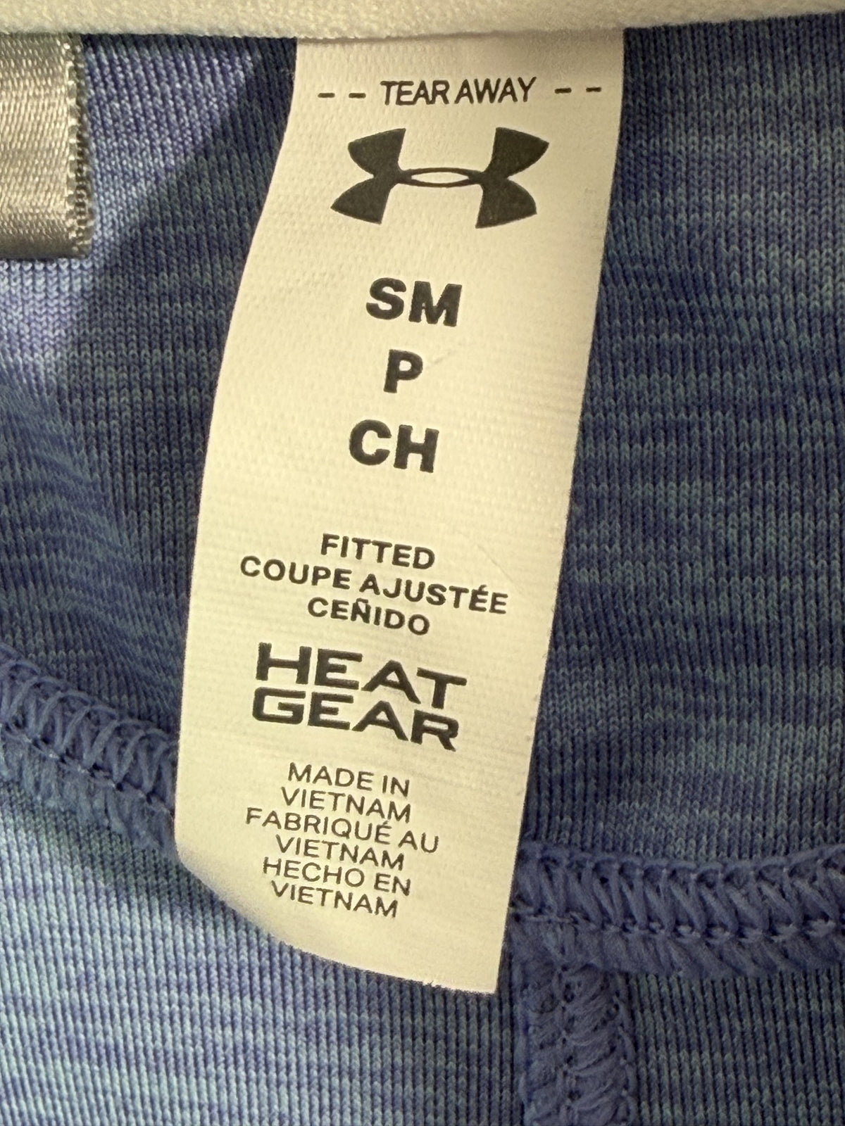 Under Armour Polo brand and size label