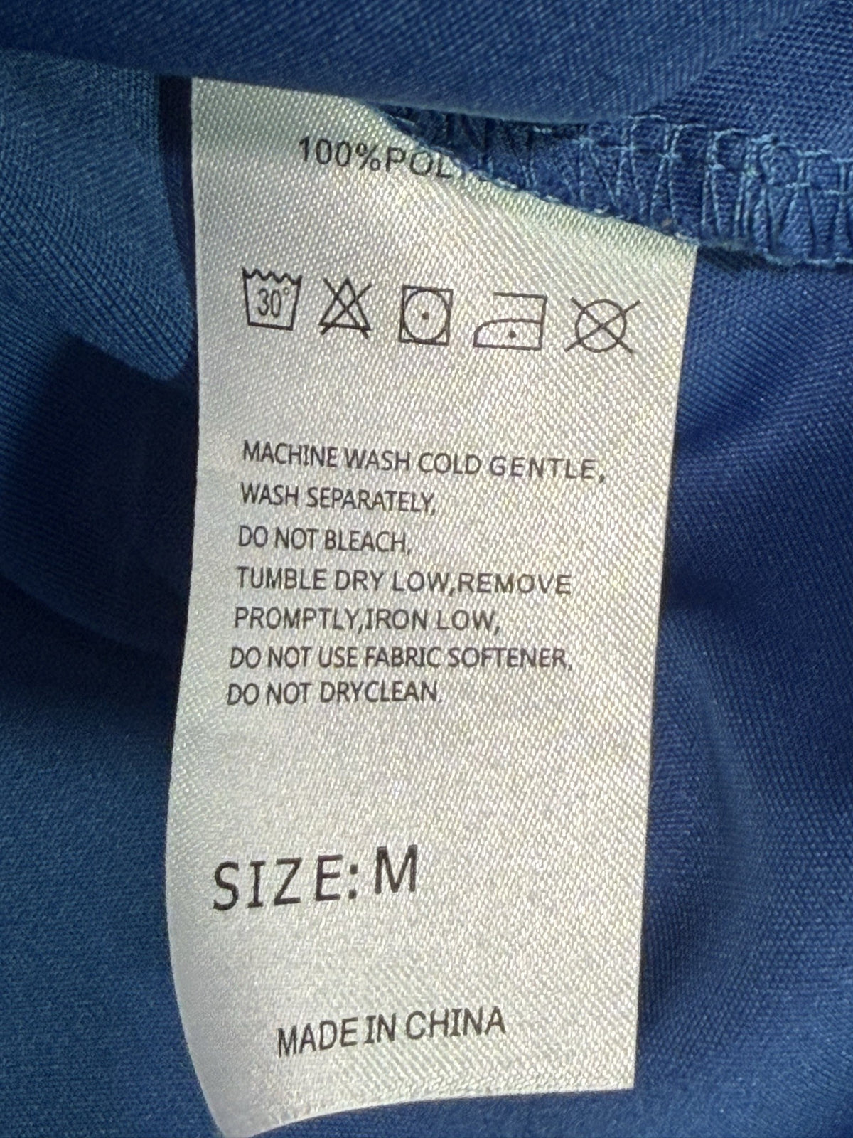 Santiny Sleeveless Polo brand and size label