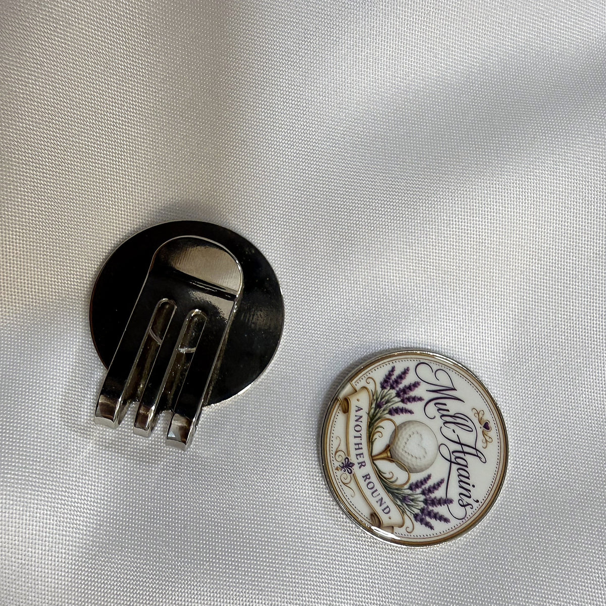 Back of the hat clip with the ball marker beside it
