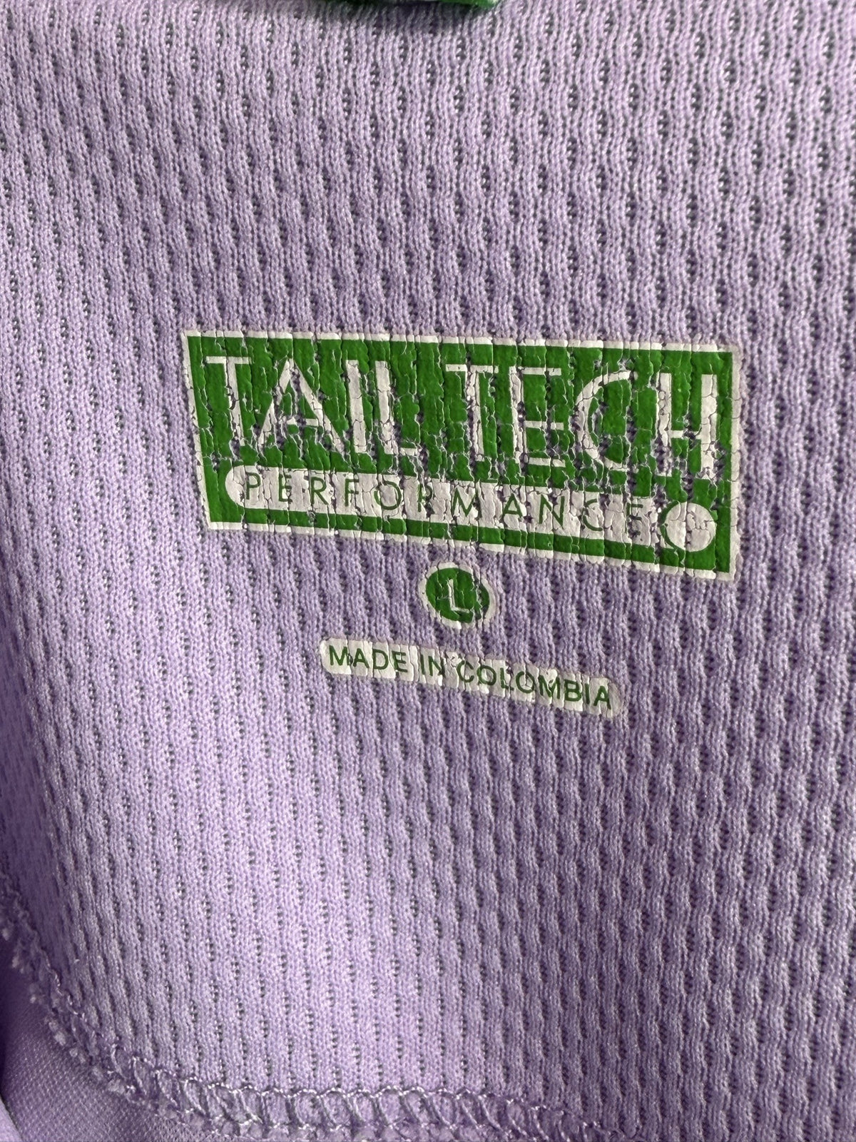 Tail Sleeveless Polo brand and size label