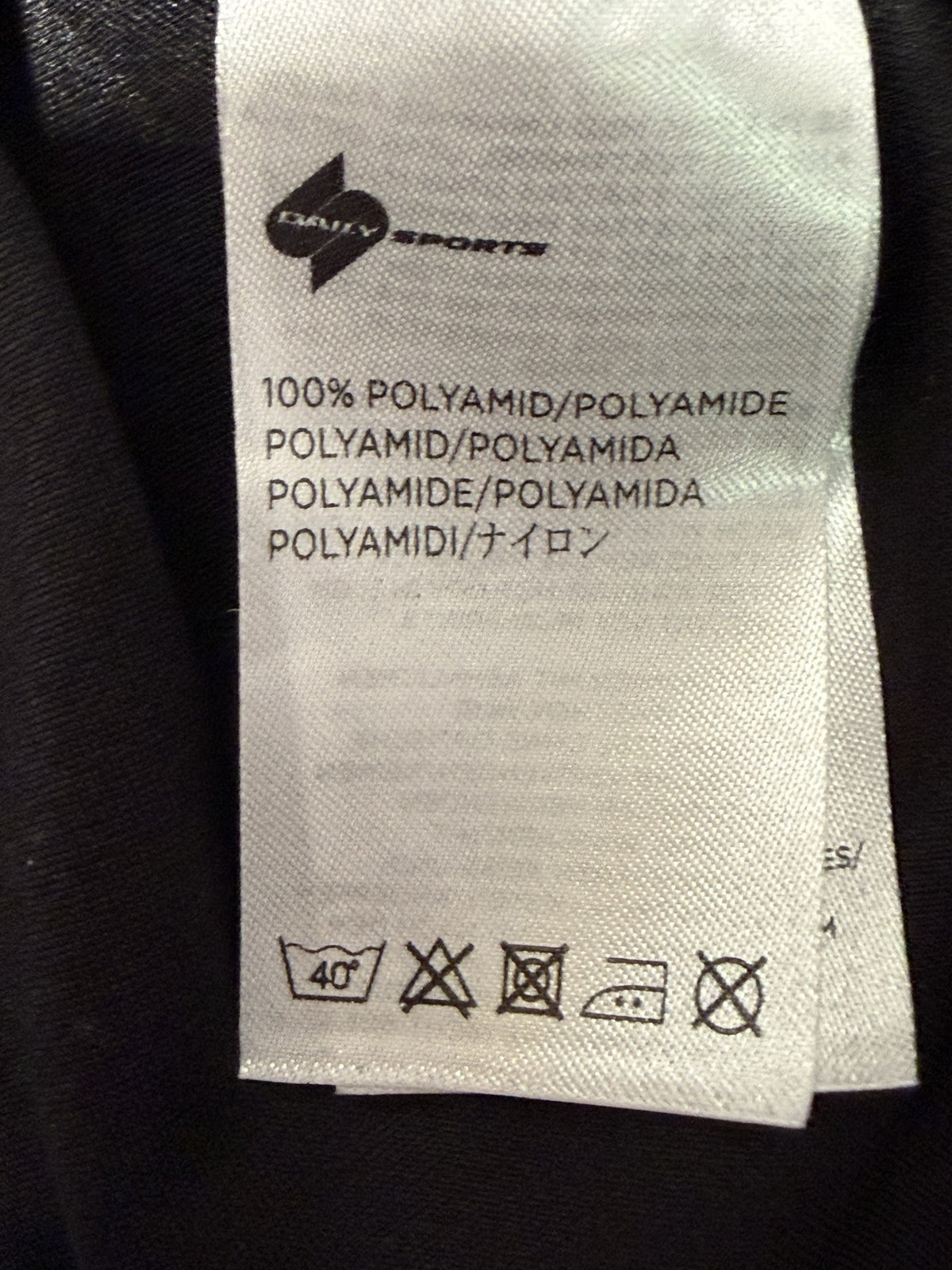 XDS by Daily Sports Long-Sleeve Quarter-Zip care and fabric label