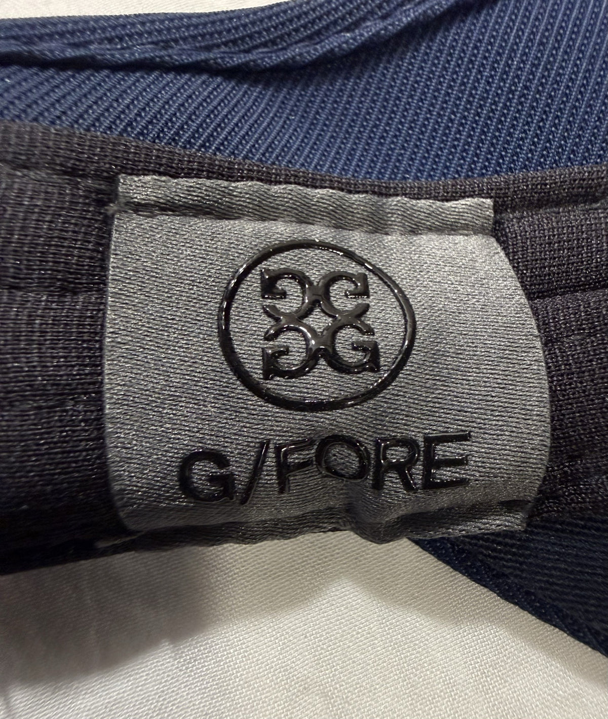 G/FORE Visor brand and size label