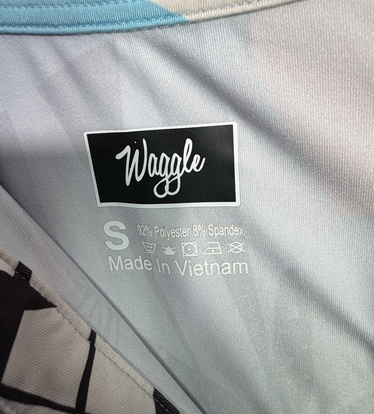 Waggle Short-Sleeve Zip Polo brand and size label
