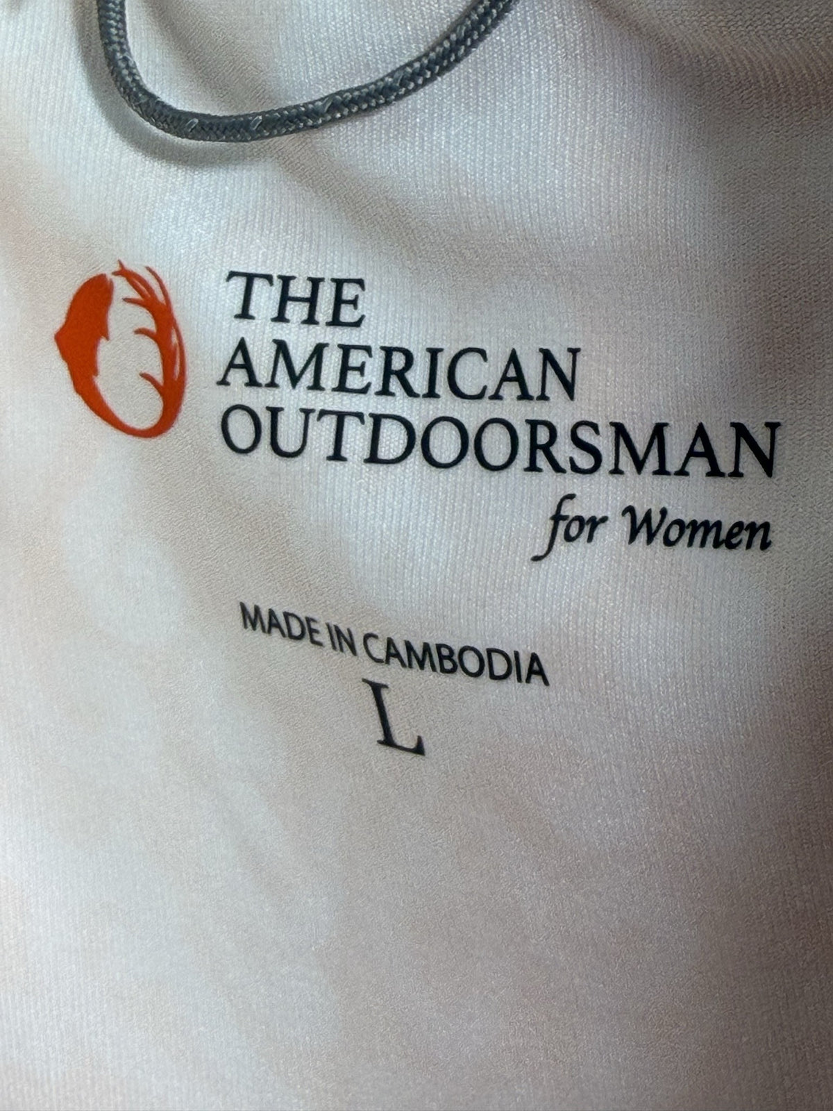 The American Outdoorsman Long-Sleeve Quarter-Zip brand and size label